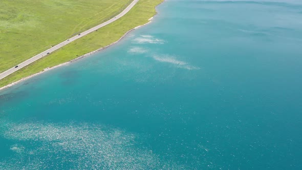 Lake and grassland with a sunny day alt
