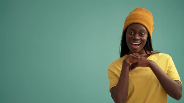 Smiling African woman dancing alt