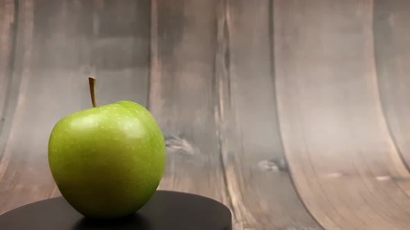 Natural Green Apple on a Wooden Background Closeup