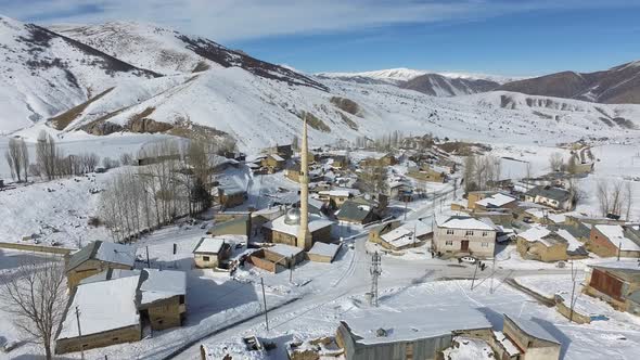 Mosque in Muslim Village in Snowy and Mountainous Valley alt