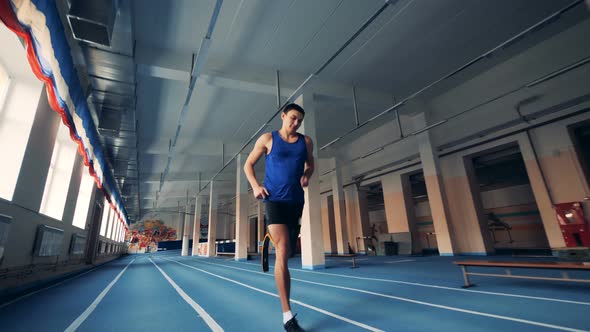 One Man with Artificial Leg Running on a Track, Modern Prosthesis alt