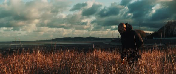 Man walks  in nature alt