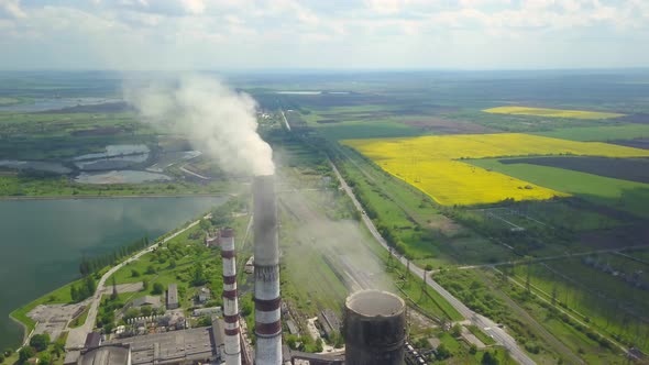 Chimneys of a Thermal Power Plant. Shooting From the Height of an Energy Object Running on Fossil