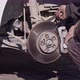 Mechanic Repairing The Brake Disc Of The Car - VideoHive Item for Sale