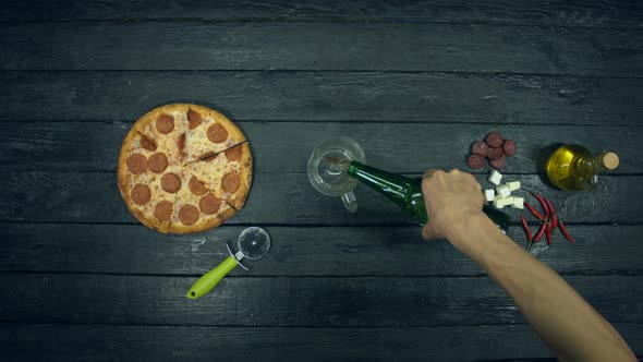 Beer and Pepperoni Pizza on Ecological Black Background