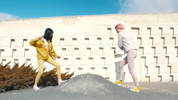 Two fashionable woman golfing with a real egg alt