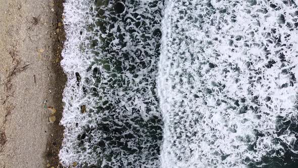 Vertical orientation video: Beautiful sea waves. Foamy wave, water texture. Sea expanse landscape