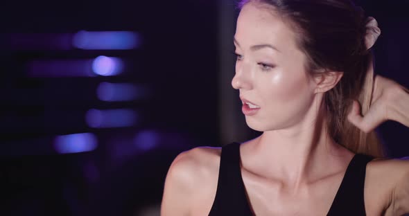 Exhausted Female Athlete Taking Break After Exercise alt