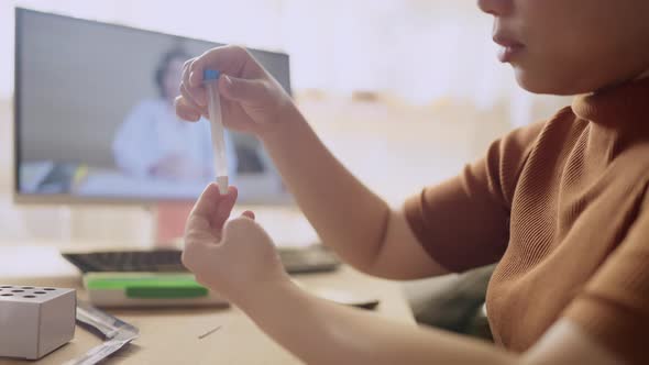 asian female hand nasal antigen swab testing rapid tests by herself for detection alt