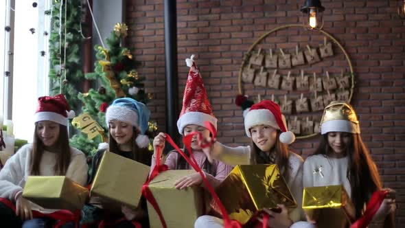 Children with New Year's gifts in their hands, celebrating Christmas and New Year alt