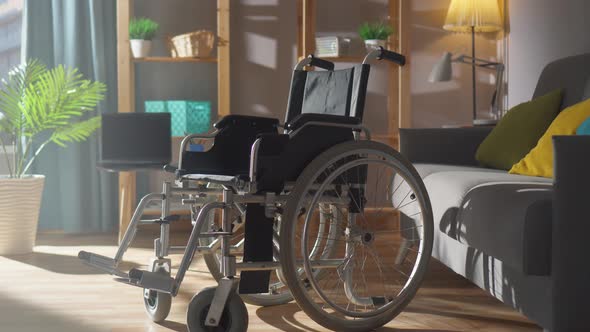 Wheelchair on the Background of a Modern Apartment on a Sunny Day Closeup Nobody alt