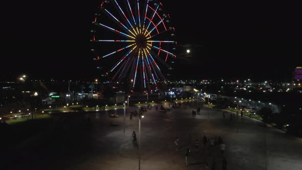 Batumi, Georgia - August 12 2020: Flying at night over the central boulevard in Batumi alt