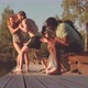 Man Pushing His Girlfriend into Water from Pier - VideoHive Item for Sale