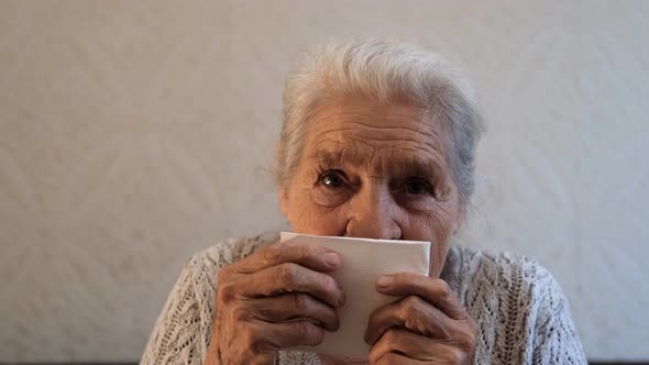 Portrait of an Elderly Woman Sneezing