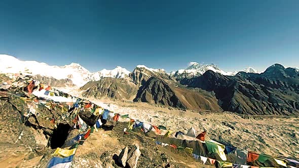Gokyo Ri Mountain Top. Tibetan Prayer Buddhist Flag. Wild Himalayas High Altitude Nature and Mount alt