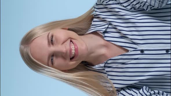 Beautiful Woman Covering Her Face with Hands, Then Opening It and Smiling alt