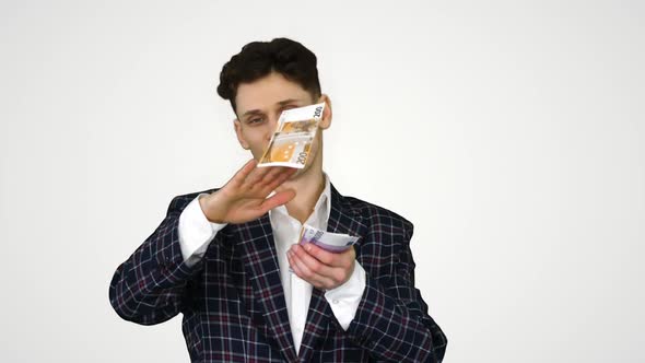 Wealthy Businessman Throwing Money in Air on Gradient Background. alt