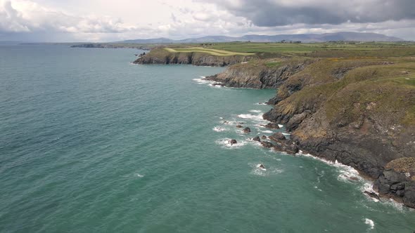 Drone shot of a long coast line in Waterford, Ireland. alt