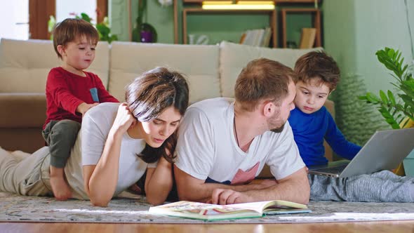 Down on the Floor Happy Mom and Dad Spending Time alt