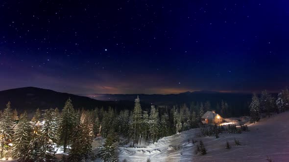 Stars Moving Above Small House In The Mountains In WInter. Ukraine, Carpathian alt