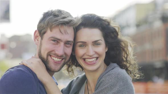 Couple bursting out laughing alt