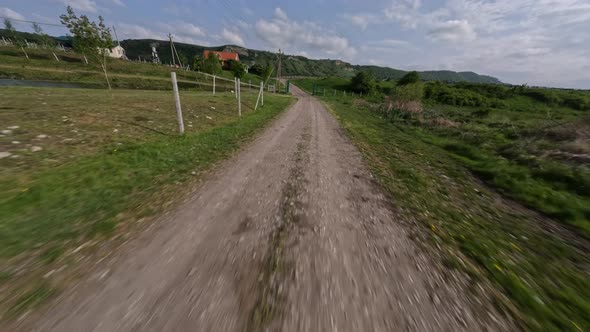 Speed Aerial View Dirt Road at Countryside Village Summer Natural Landscape Infrastructure alt
