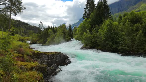 Milky Blue Glacial Water From the Kjenndalsbreen Glacier alt