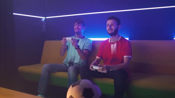 Handheld Focused Gamers Plays a Video Game on a Game Console the Confrontation of Two Players alt