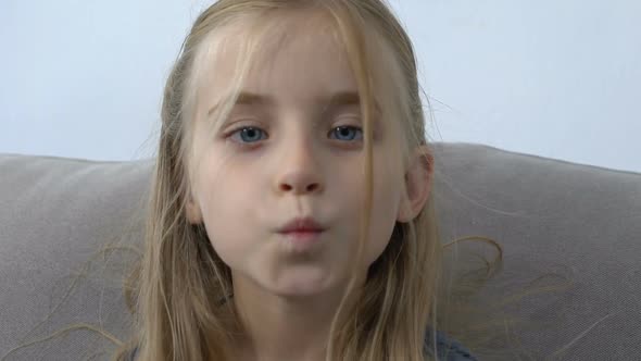 Adorable Caucasian Girl Sending Air Kiss on Camera, Sincere Childhood Emotions