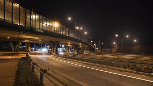 Timelapse Car Traffic Road Junction Highway in Big City at Night alt