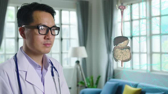 Asian Male Doctor Working On 3D Human Digestive System, Medical Technology Concept alt