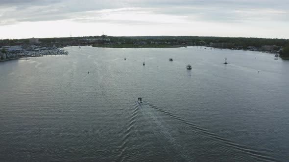 Aerial Tracking Shot of Boat Coming into a Quiet Harbor (Norwalk, Connecticut)