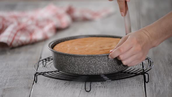 Confectioner Taking Out of Cake From Cake Mold.