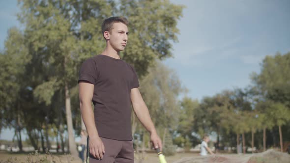 Assistant Referee Raising Flag for Offside Trap alt