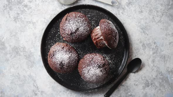Fresh and Tasty Chocolate Muffins Served on Plate alt