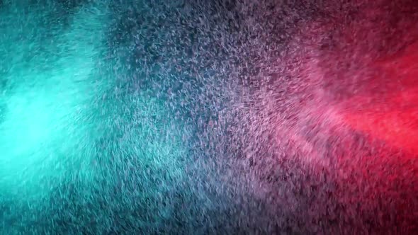 Green and Red Water Spray Mixed on a Black Background. Slow Motion alt