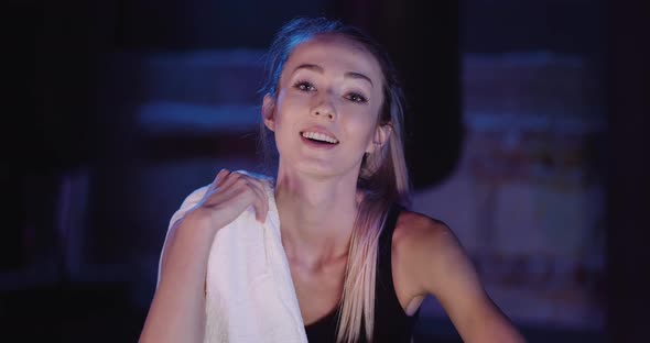 Exhausted Woman Taking Break From Exercise alt