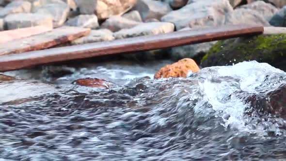 Pure Mountain Water Flows Over Rocks