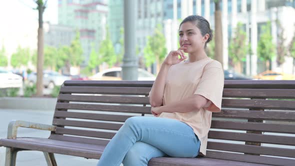 Pensive Indian Woman Thinking While Sitting in Office alt