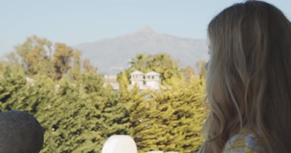 Pretty Blonde Model By Porch Looking at the Panoramic Mountain and Tree Scenery alt