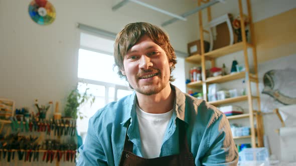 Smiling master looking at camera talk make live video conference call online alt