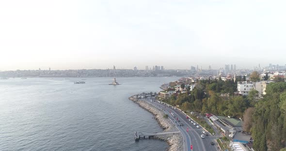 View from Üsküdar Harem coastal road to Maiden's Tower with drone alt