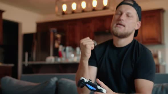 A Determined Male Gamer Who Experiences Emotional Stress When He Plays Video Games alt