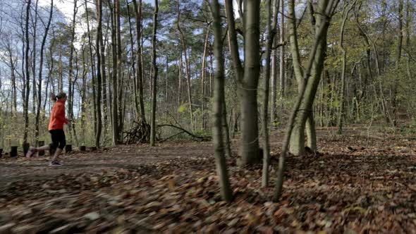 One Woman Running in Forest