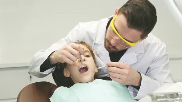 A Sweet Girl Undergoes an Annual Examination at the Dentist alt
