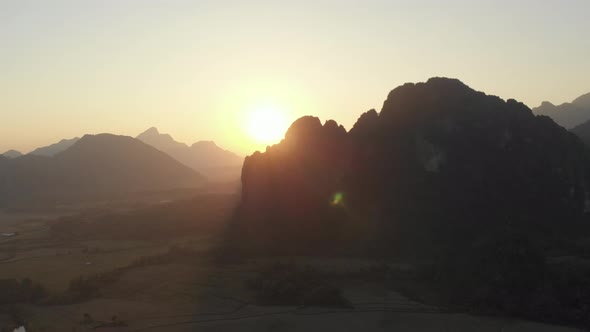 Aerial: Vang Vieng backpacker travel destination in Laos, Asia. alt