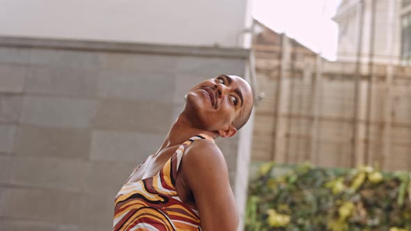 Fashion Models Dancing Together In Brightly Coloured Clothing alt