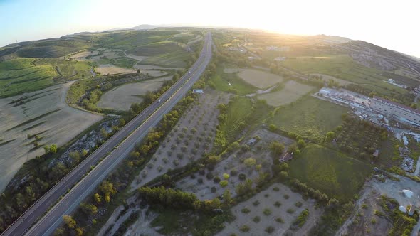 Agricultural Fields and Fruit Gardens on Cyprus Hills, Road Traffic, Aerial View alt