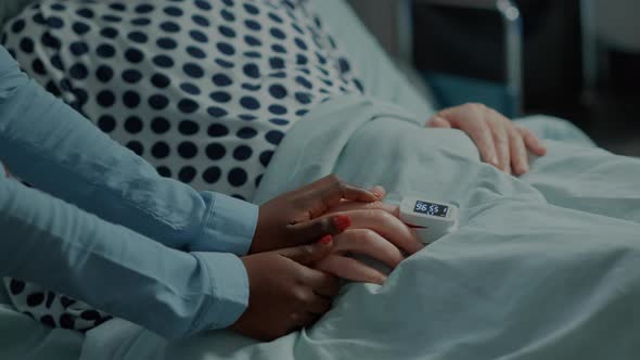 Old Patient with Oximeter in Hospital Ward at Medical Unit alt