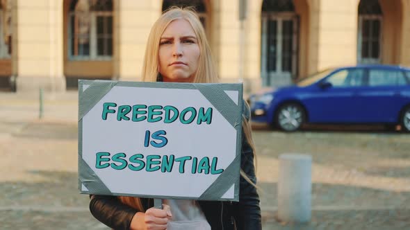 Woman on Protest Walk Calling That Freedom Is Essential alt